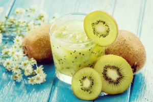 kiwi juice with fresh fruits on blue wooden table